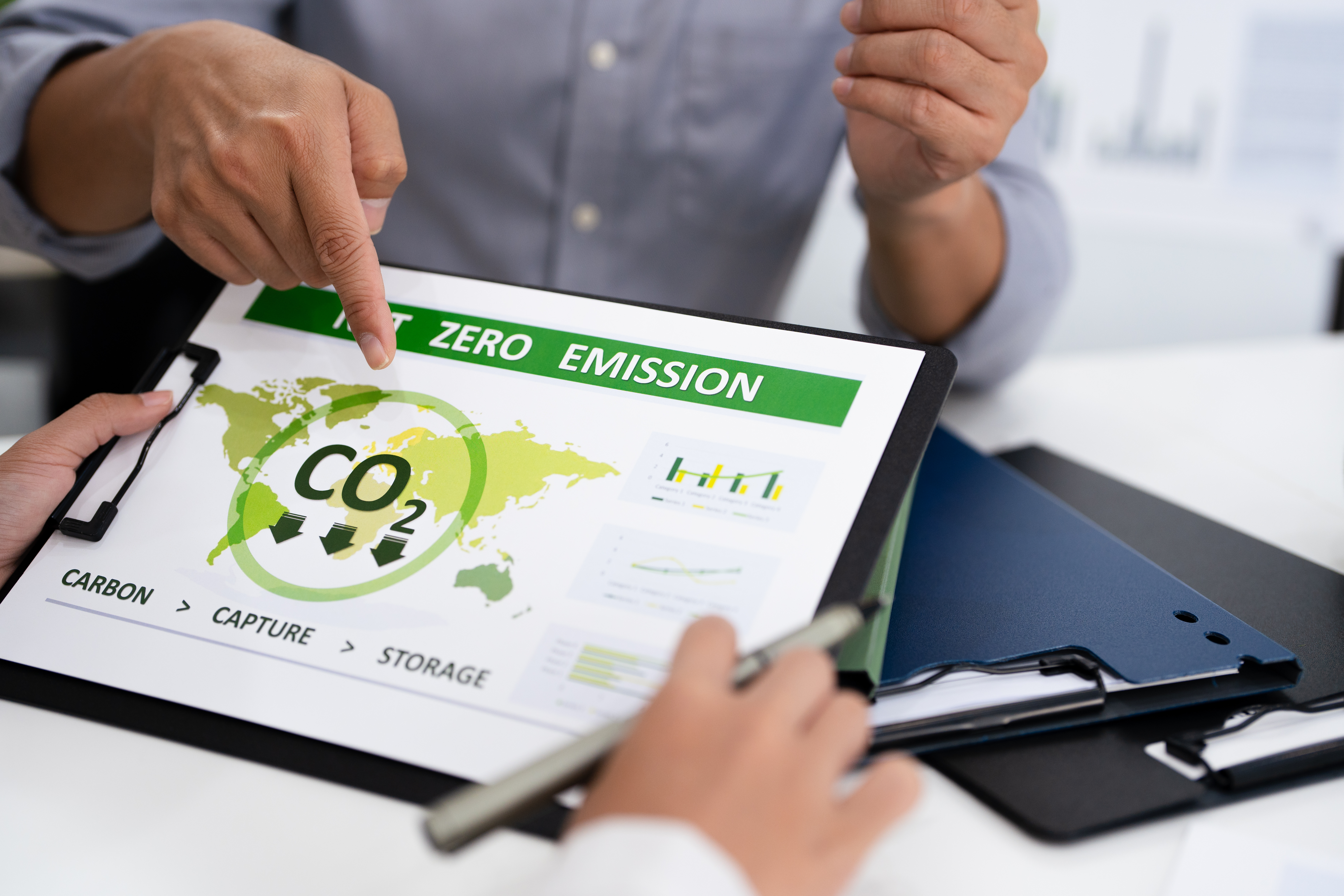 A Goal action to climate change.A businessman in meeting room, presenting ESG targets.